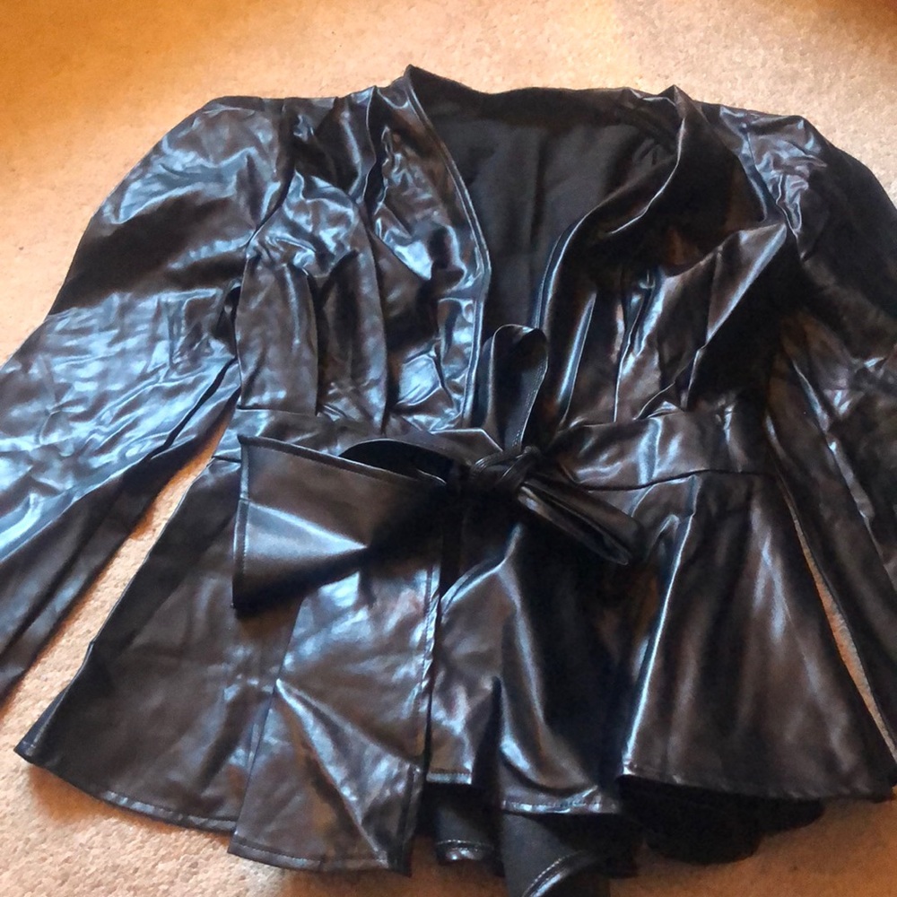 This is a faux leather black peplum rye front top or jacket size Large